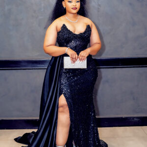 Posing for a picture in a black sequins dress