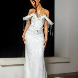 Custom white beaded lace and satin off-the-shoulder matric dance dress with crystal fringe detailing worn by a young woman.